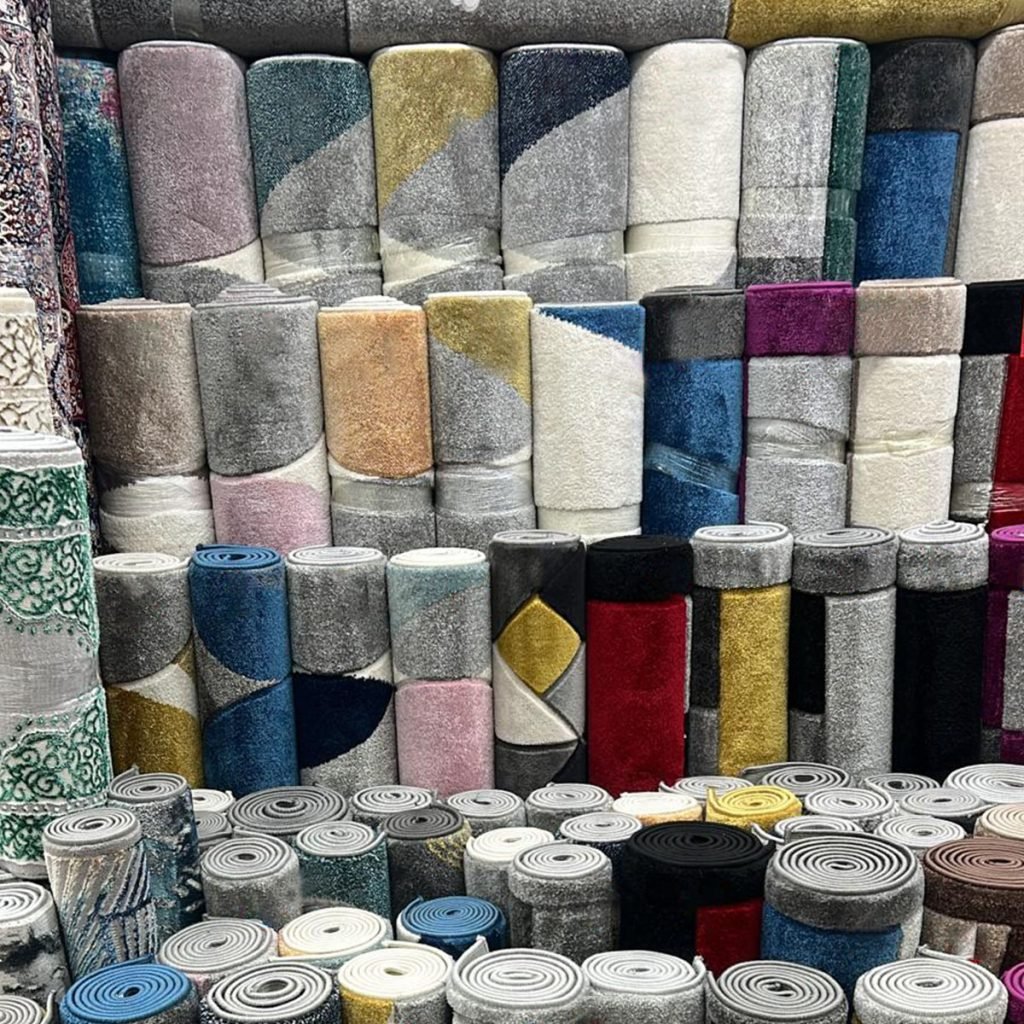 Rolled rugs in a range of colours