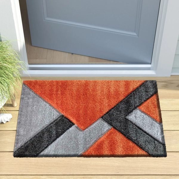 Nova geometric shaggy rug in Orange Grey