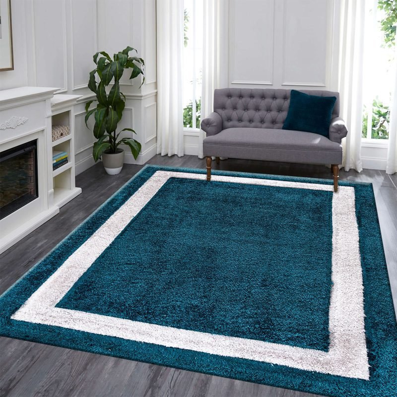 Trani rug in teal with a cream border