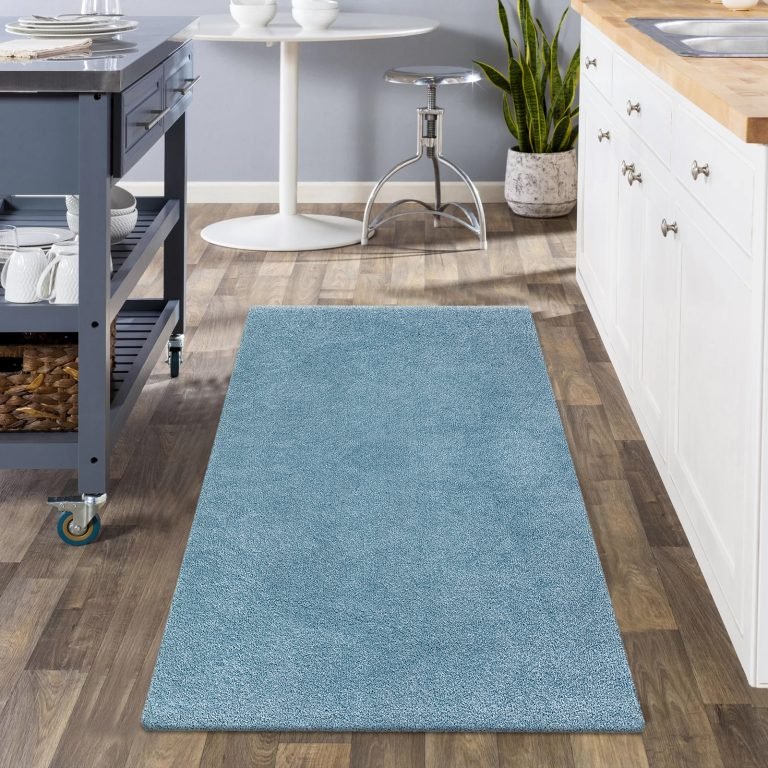 Blue runner rug along a hallway
