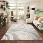 Gant Beige abstract rug 160 x 230 cm, low pile with jute back and non-slip strip, in a room setting