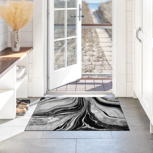 Gant Abstract Rug Black Grey 60 x 110 cm Gant Black Grey abstract rug 60 x 110 cm, low pile with jute back and non-slip strip, in a room setting