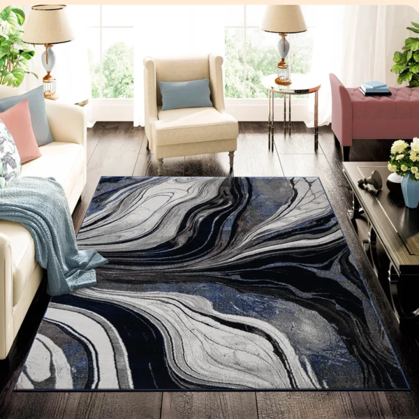 Gant Blue abstract rug 120 x 170 cm, low pile with jute back and non-slip strip, in a room setting