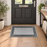 Greeky Grey Black bordered rug 40 x 60 cm with Greek key border, low pile and non-slip backing, in a living room