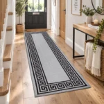 Greeky Grey Black bordered rug 66 x 220 cm with Greek key border, low pile and non-slip backing, in a living room