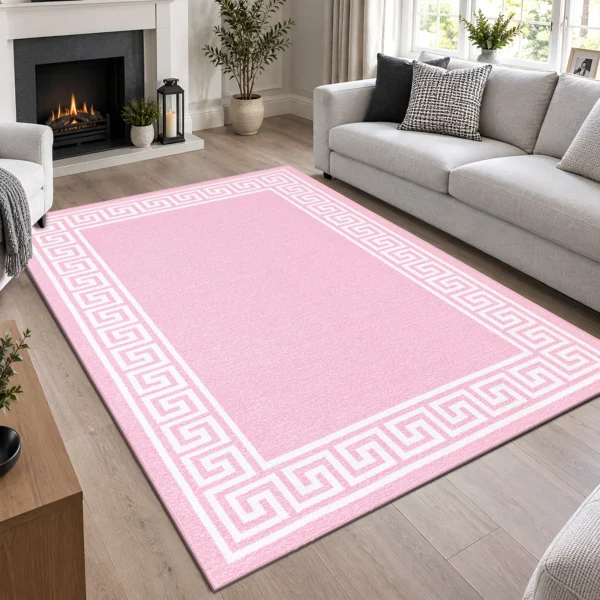 Greeky Pink bordered rug 160 x 230 cm with Greek key border, low pile and non-slip backing, in a living room