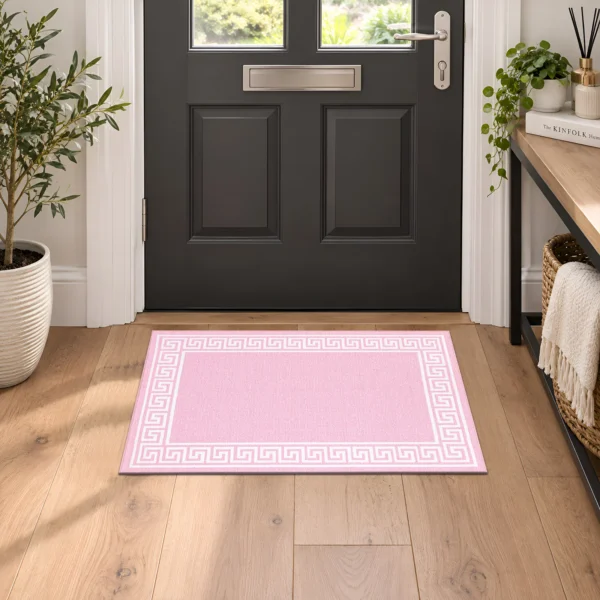 Greeky Pink bordered rug 40 x 60 cm with Greek key border, low pile and non-slip backing, in a living room