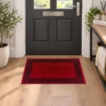 Greeky Red Black bordered rug 40 x 60 cm with Greek key border, low pile and non-slip backing, in a living room