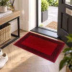 Greeky Red Black bordered rug 50 x 80 cm with Greek key border, low pile and non-slip backing, in a living room