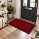 Greeky Red Black bordered rug 66 x 120 cm with Greek key border, low pile and non-slip backing, in a living room
