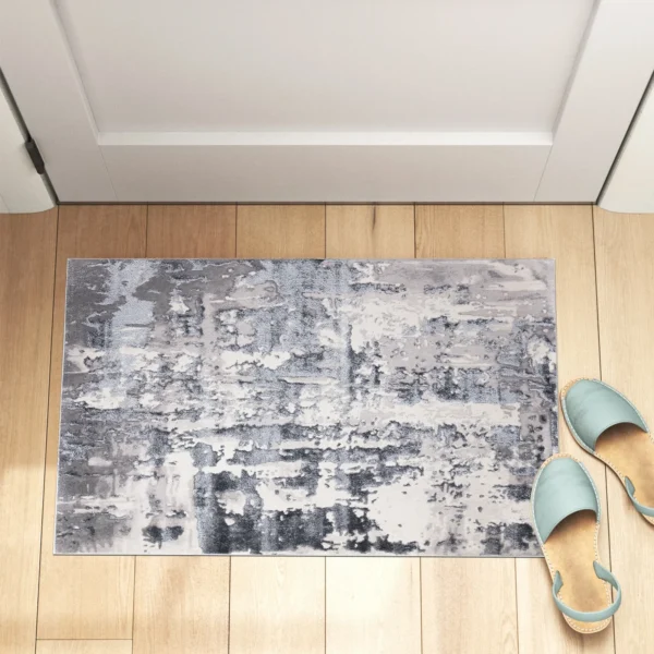 Grey modern abstract rug 60 x 110 cm, low pile with jute backing, in a living room