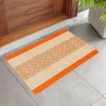 Nada Orange geometric rug 50 x 80 cm, low pile with non-slip gel back, in a room setting