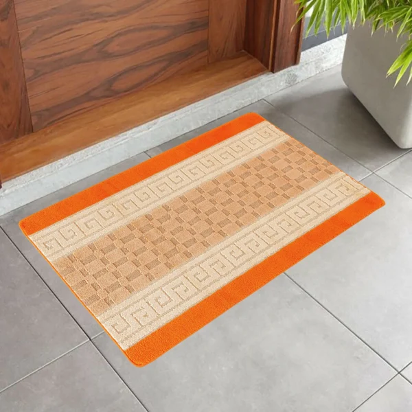 Nada Geometric Rug Orange 50 x 80 cm Nada Orange geometric rug 50 x 80 cm, low pile with non-slip gel back, in a room setting