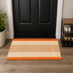 Nada Orange geometric rug 60 x 110 cm, low pile with non-slip gel back, in a room setting