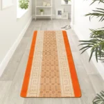 Nada Orange geometric rug 60 x 220 cm, low pile with non-slip gel back, in a room setting